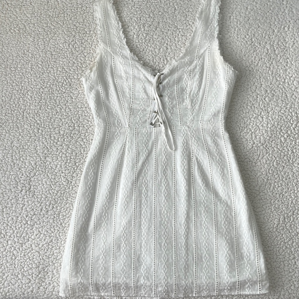 white dress with liner, tie in the front, and zipper on back